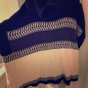 Wide neck poncho sweater.